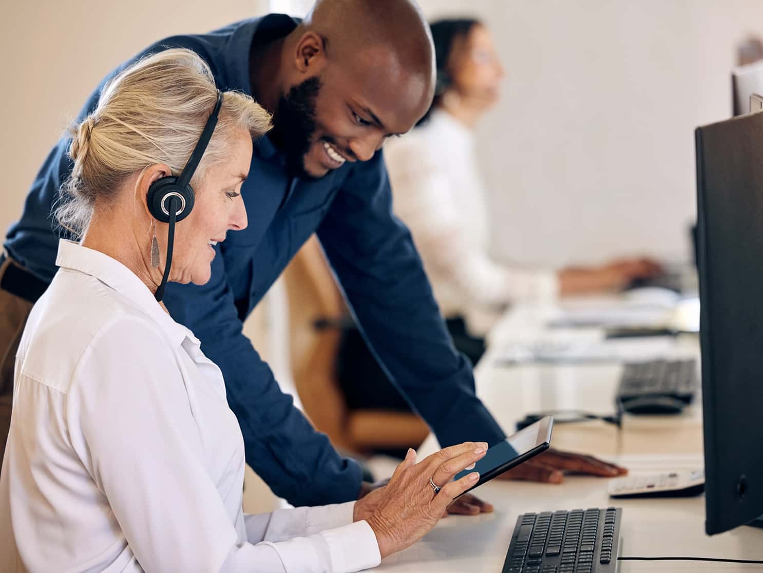 EBRM support team assisting a broker with health plan case details